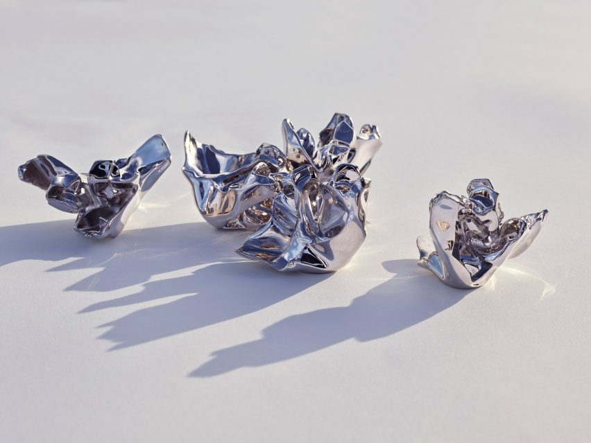 Five silver aluminium perfume bottle caps