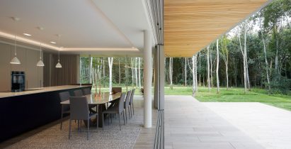 Dining space in House in The Lakes by Yoo, by Broadway Malyan