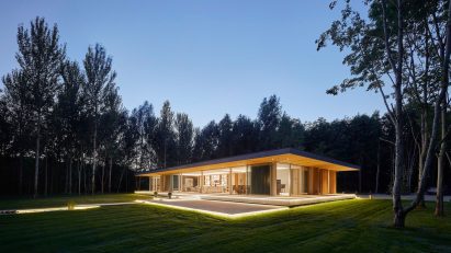 Night view of House in The Lakes by Yoo, by Broadway Malyan