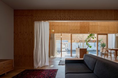 A living room with curtain partitions