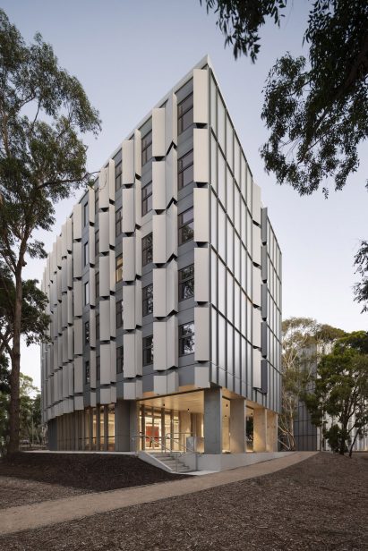 A building has a white panelled exterior
