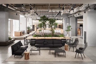 Seating area in Kadokawa office with black couches and grey armchairs