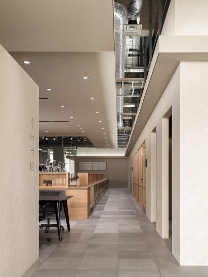Office hallway with grey flooring tiles by Flooat