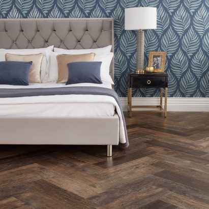 A bed is pictured on top of the floor