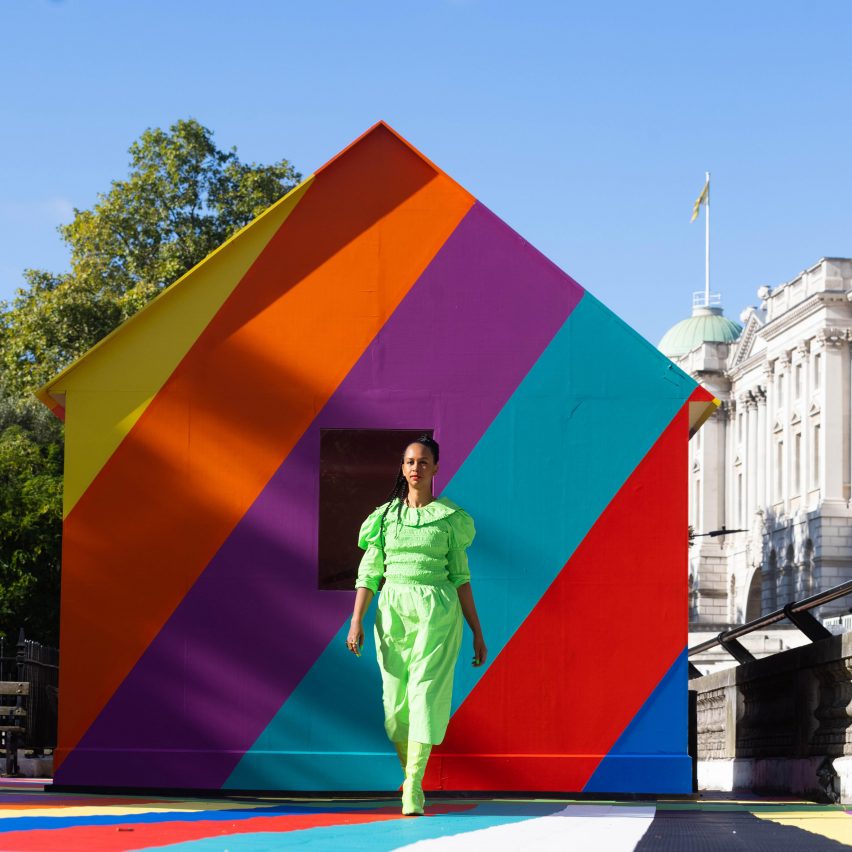 Lakwena Maciver in front of a colourful shed