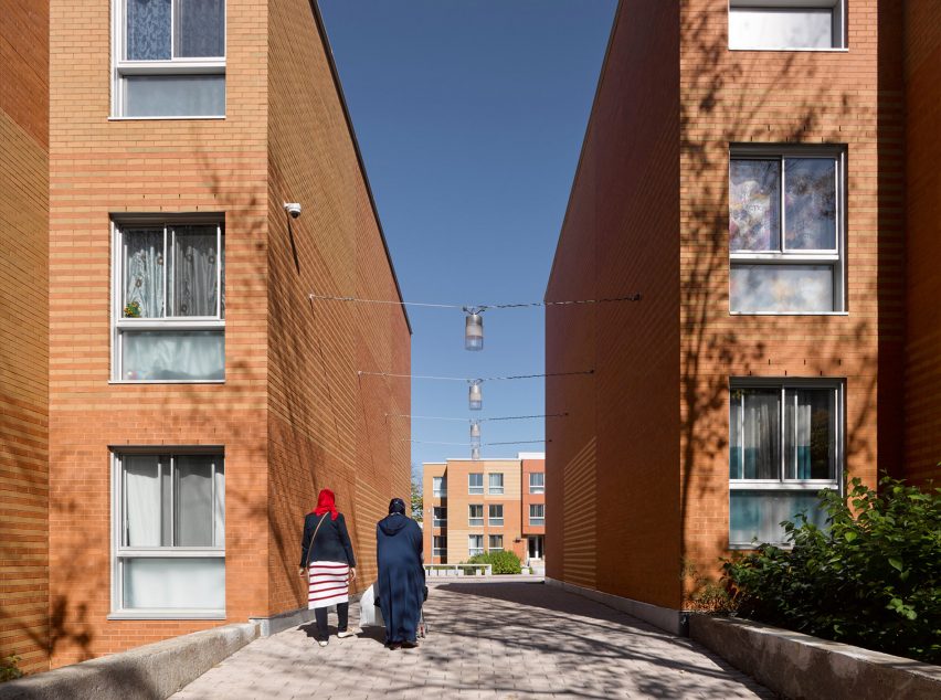 Montreal housing complex by Saia Barbarese Topouzanov renovated with colourful spiral staircases