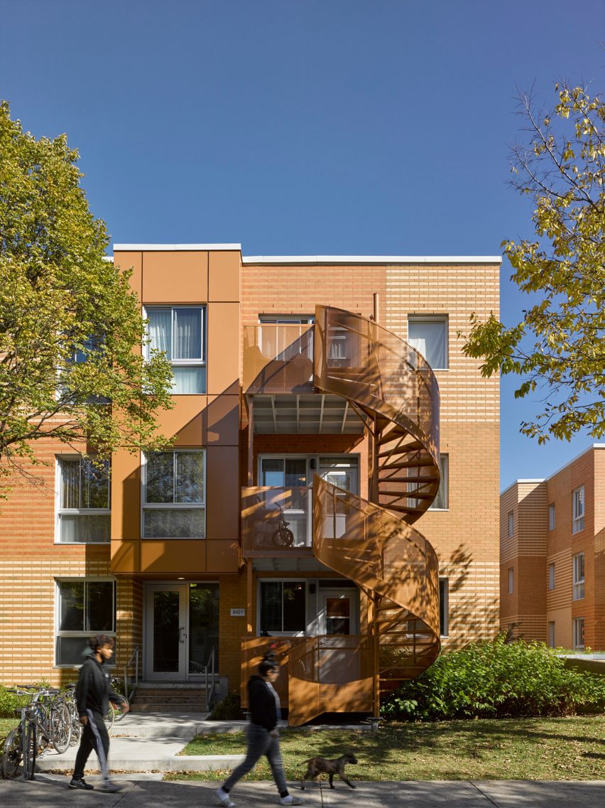 Montreal housing complex by Saia Barbarese Topouzanov renovated with colourful spiral staircases
