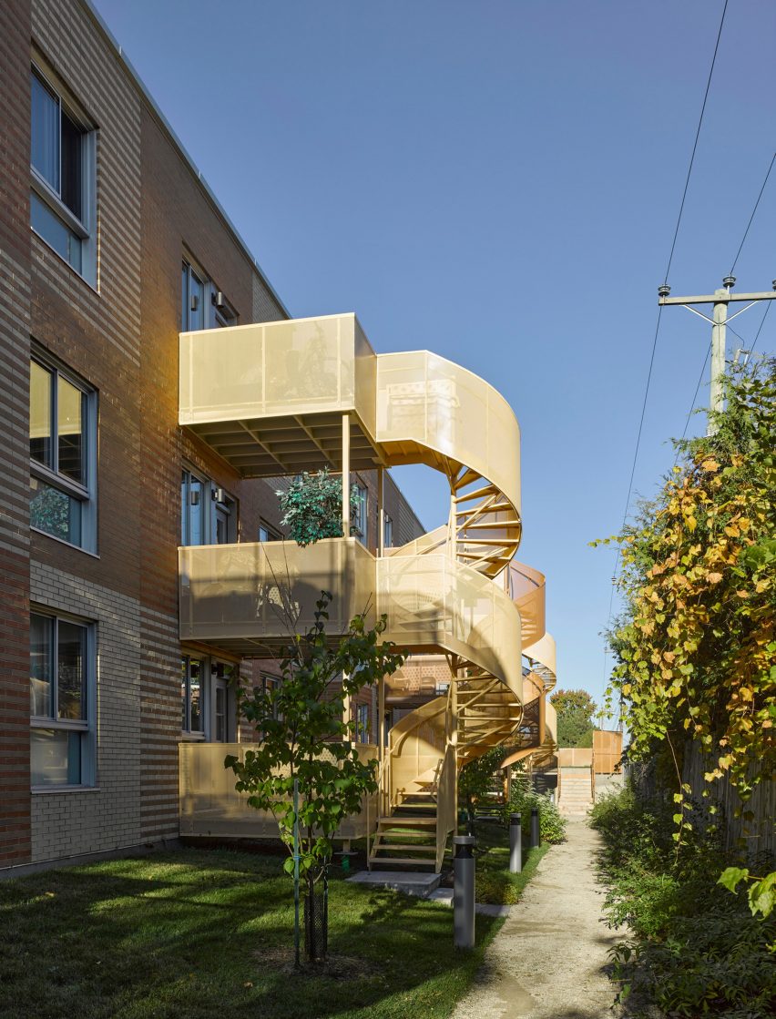Montreal housing complex by Saia Barbarese Topouzanov renovated with colourful spiral staircases