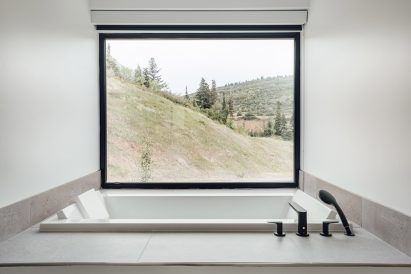 Bathroom with large glass windows