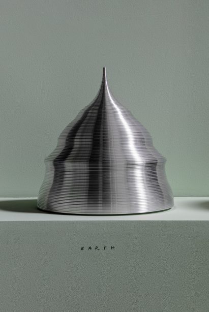 A bell-shaped State of the World sculpture