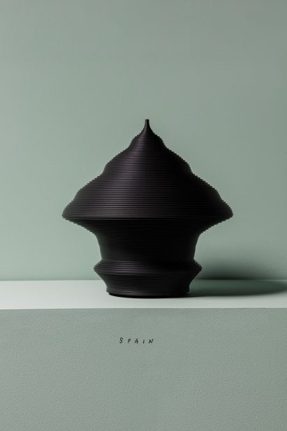 A black sculpture shaped like a pyramid