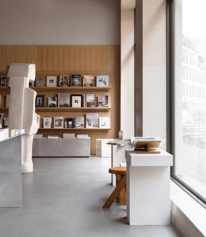 Stone sculpture in wood-panelled bookstore