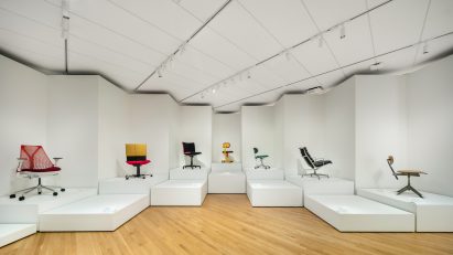 A display of chairs on white platforms