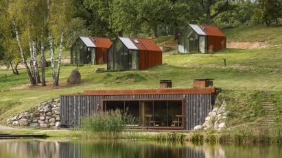 There are three cabins and a spa set on sloped terrain
