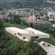 The exterior of the villa is cream hued