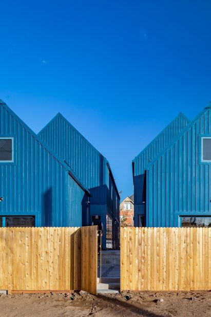 Wood fences the complex into its plot of land