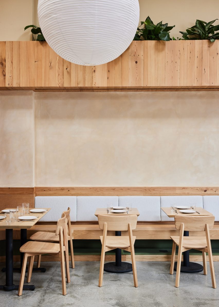 Banquette seating with wooden planter above
