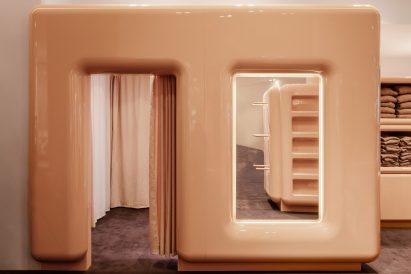A beige doorway leading to a changing room