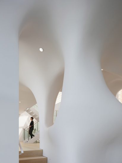 Residential interior by OPA with bulging white walls designed to resemble clouds