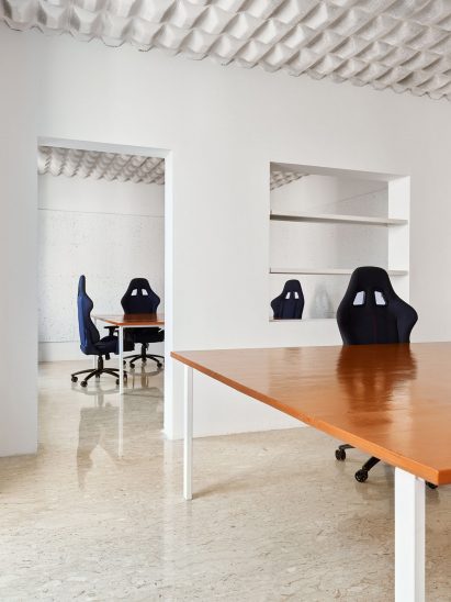 Openings in the walls lead between work spaces and rooms