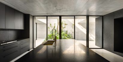 Monolithic black granite blocks form the inside