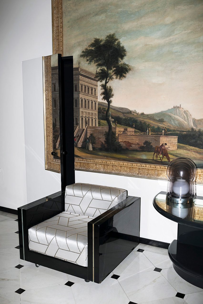 The Intarsiato fabric in silver being used to upholster the seat and backrest of an armchair