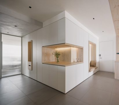 Storage wall inside Urban Cottage apartment by Lukstudio