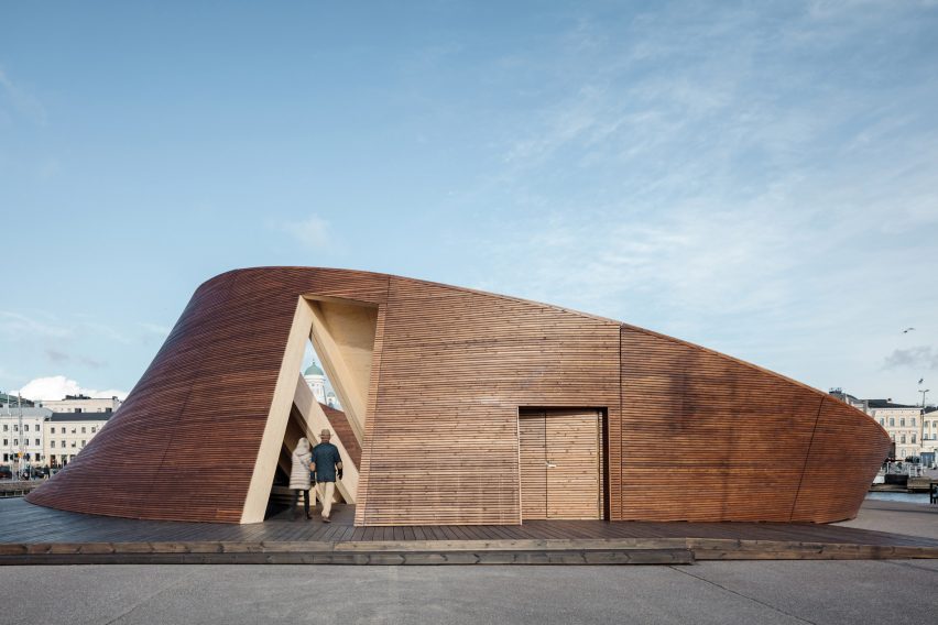 Helsinki Biennial Pavilion in profile showing its circular wooden exterior and sloping roofline