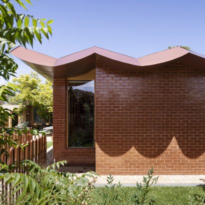 The roof of the home is scalloped