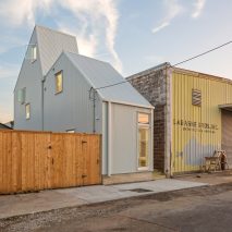 Corrugated house on a narrow suburban lot