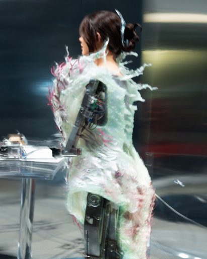 A robot wearing a blue dress