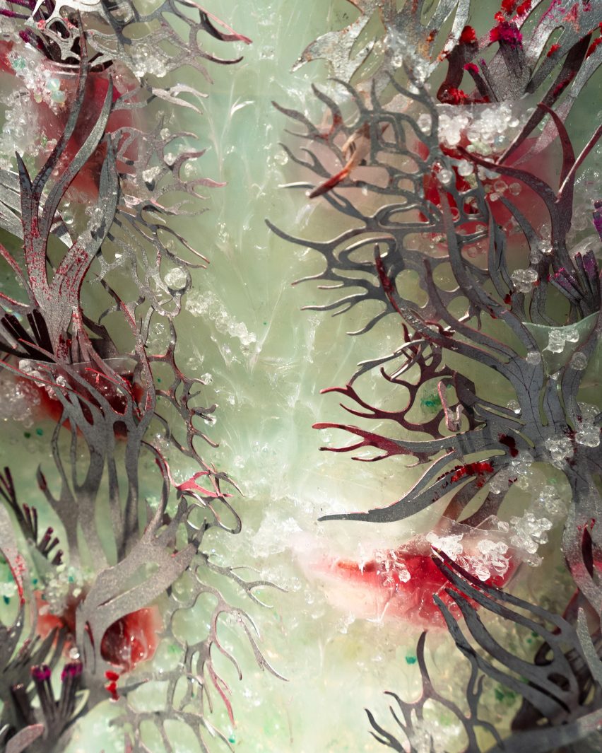 Green crystals on the underlayer of Auroroboros' dress