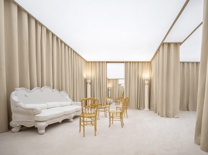Interior image of seating area at the Balenciaga 50th Couture China Special