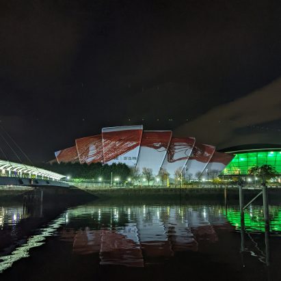 Beatie Wolfe artwork at COP26 projected onto on Glasgow's Armadillo building