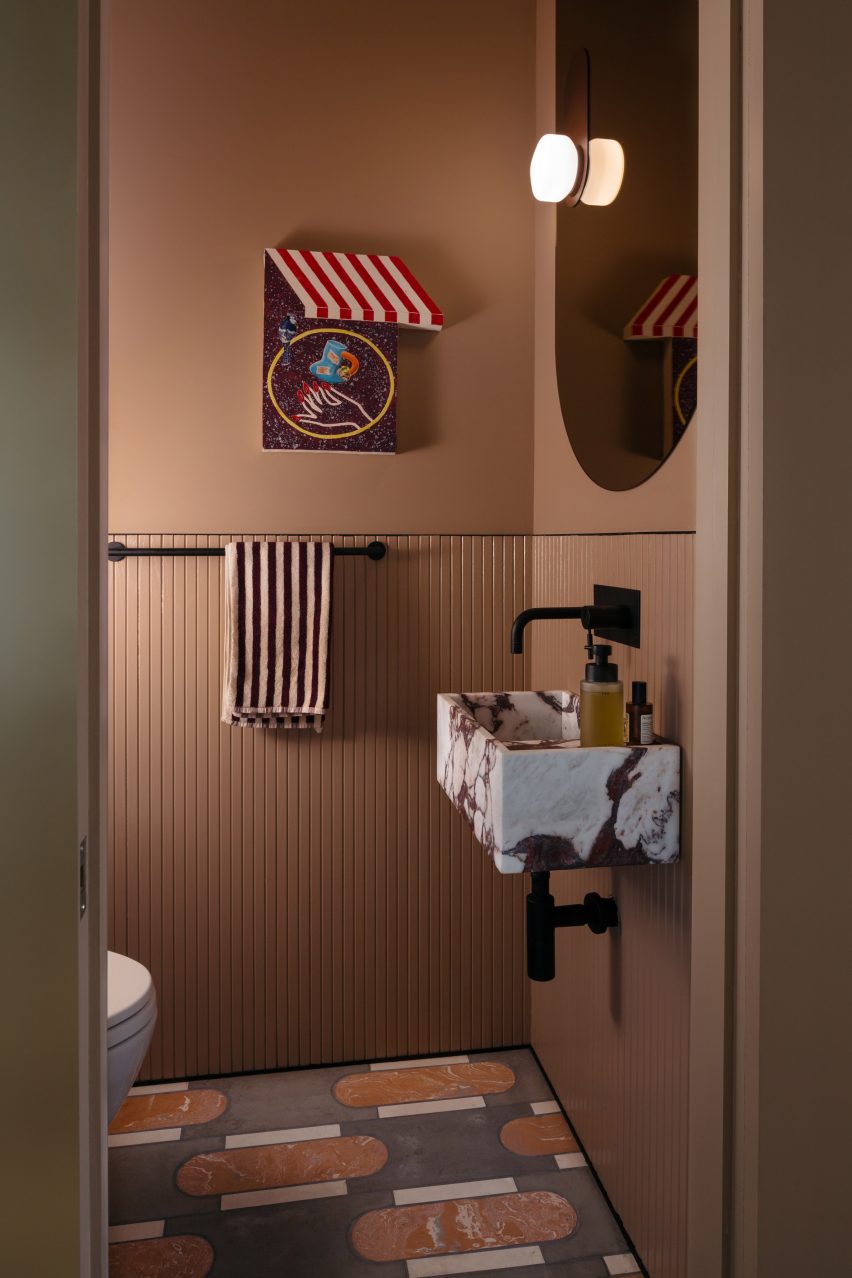 Powder room within millwork block
