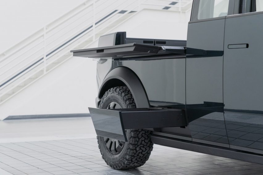 Worktables and step pulled out from the side of the Canoo Pckup truck