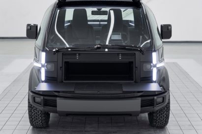 Storage space and fold-down worktable at front of the of the Canoo Pickup truck