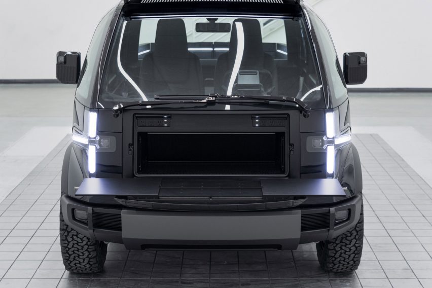 Storage space and fold-down worktable at front of the of the Canoo Pickup truck