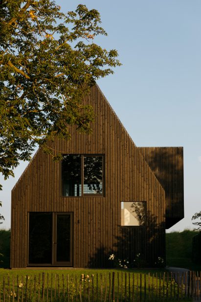 Exterior image of House With a View with sunlight hitting the building