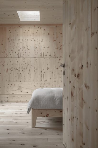 Bedroom lined with pine wood