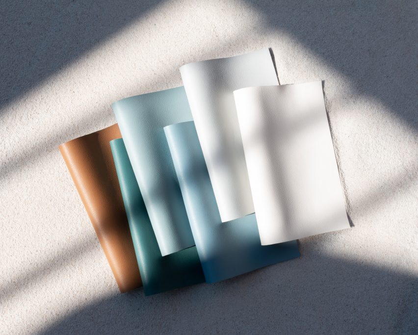 Sheets of Ultrafabrics' Coast fabrics in sandy brown, teal, light blues and white