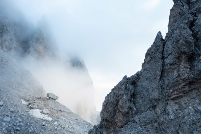 Bivouac Fanton faces downward off the edge of a cliff