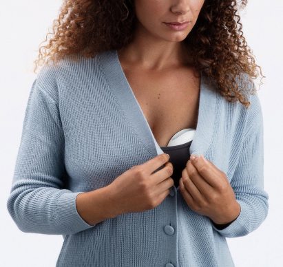 Silicone breast pump by Elvie worn inside a bra