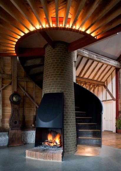Living area with tapering brick fireplace