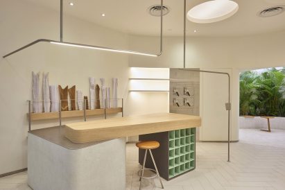 The table has a wooden top at Ginlee Studio store