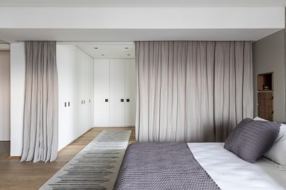 Concrete walls in main bedroom