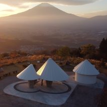 View of the Oath Hill Park structures with a mountainous landscape in the distance