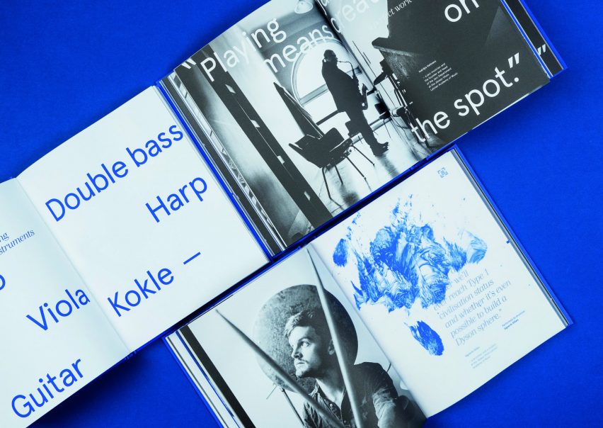 Pages of the publication 100 Years of the Jazeps Vitols Latvian Academy of Music showing a blue paint smear graphic and black and white full-page photography
