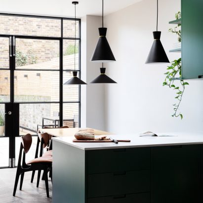 Kitchen with dark green cabinets