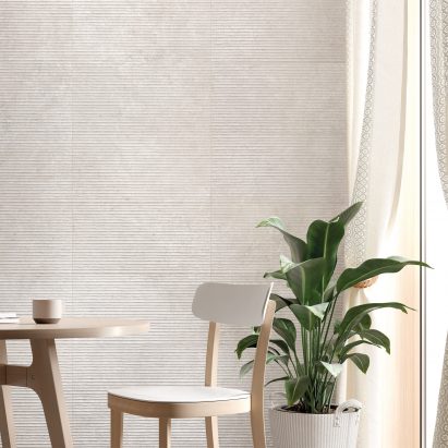 Roca's Limestone tiles in white used in a contemporary dining room interior